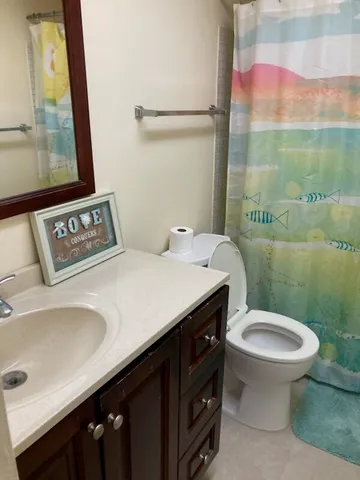 a bathroom with a sink and a toilet