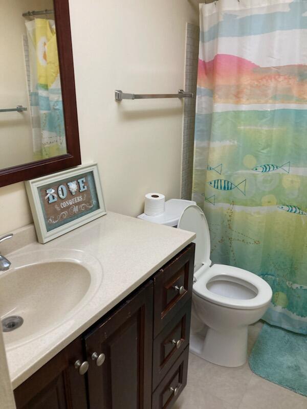 950 South Kanner Highway, Unit C2 Stuart, FL 34994 - Photo 9 of 14 a bathroom with a sink and a toilet