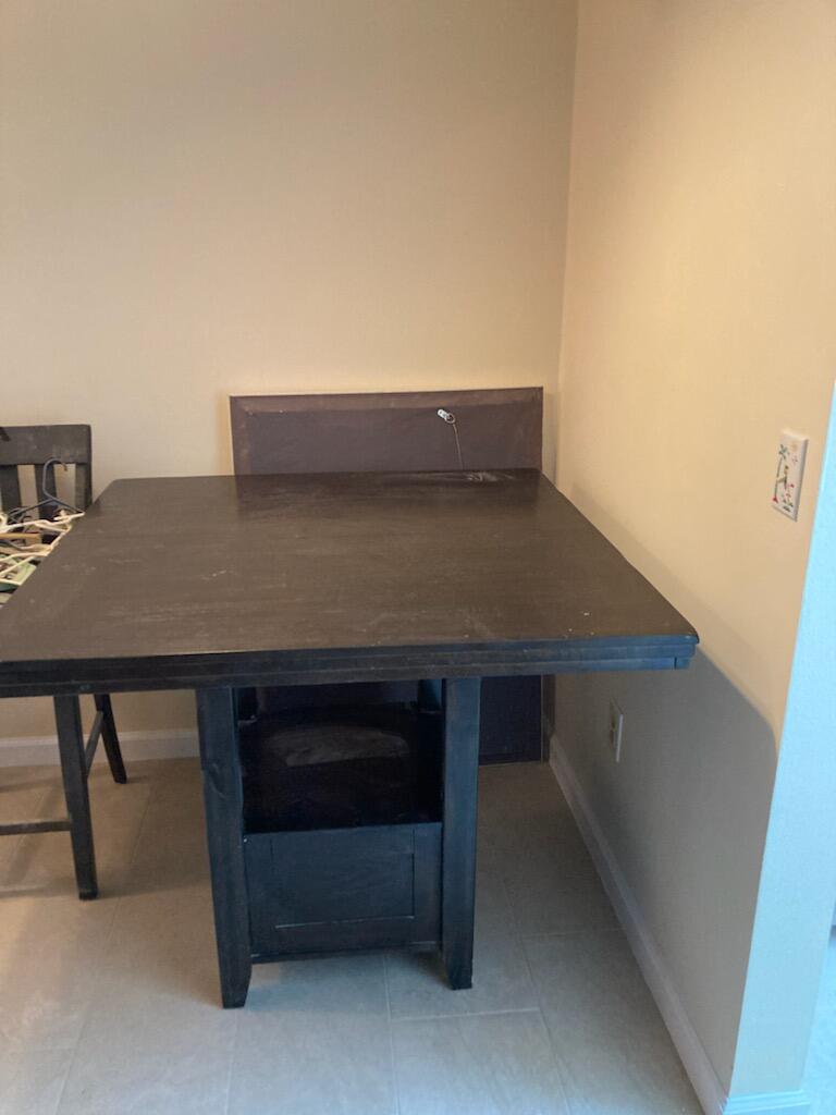 950 South Kanner Highway, Unit C2 Stuart, FL 34994 - Photo 10 of 14 a view of table and chair in the room