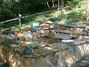 415 Freeman Falls Road Acme, PA 15610 - Photo 3 of 14 Stone pond