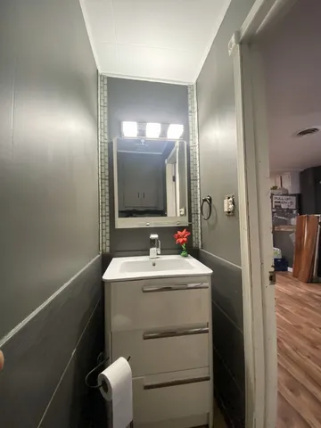 a bathroom with a sink and a mirror