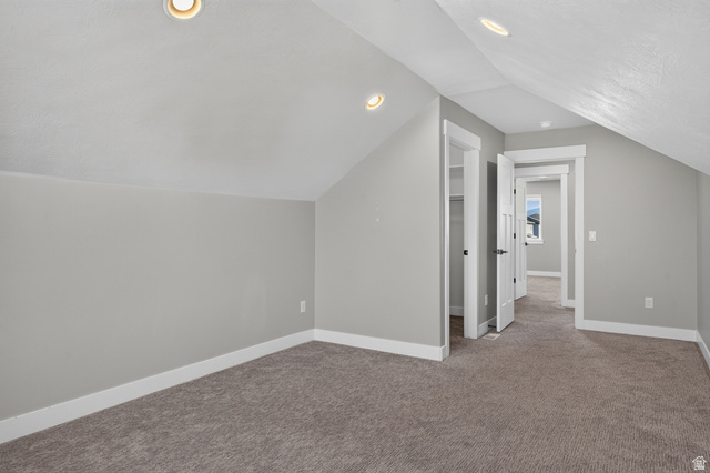 36 West Syracuse Road Vineyard, UT 84059 - Photo 43 of 56 Carpeted room featuring sloped ceilings, recessed lighting, and white baseboards