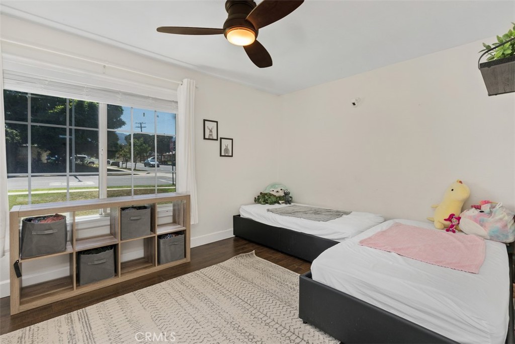 895 West Crestview Street Corona, CA 92882 - Photo 15 of 25 a bedroom with a bed and a large window