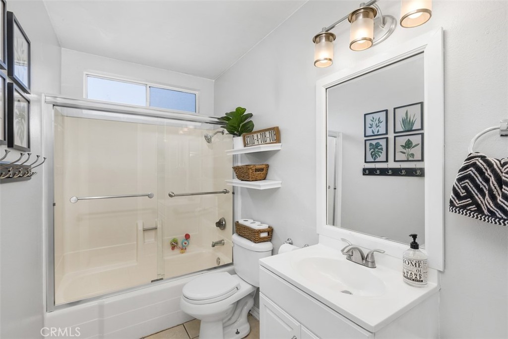 895 West Crestview Street Corona, CA 92882 - Photo 16 of 25 a bathroom with a sink a toilet and shower