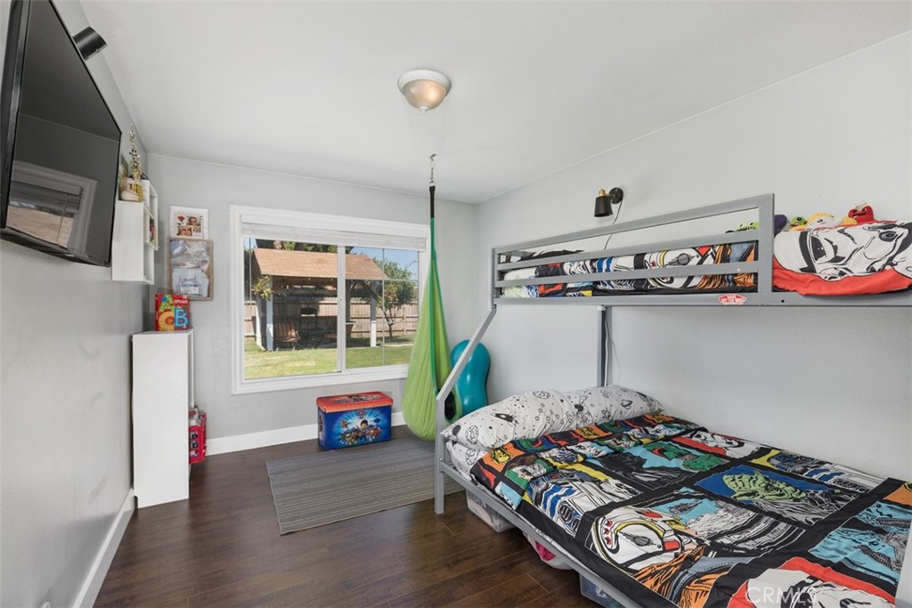 895 West Crestview Street Corona, CA 92882 - Photo 17 of 25 a bedroom with furniture and a window