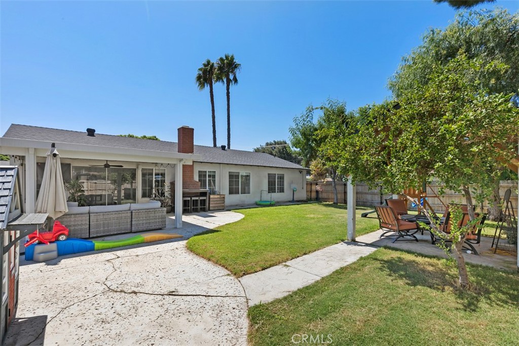 895 West Crestview Street Corona, CA 92882 - Photo 25 of 25 a front view of a house with a garden and yard