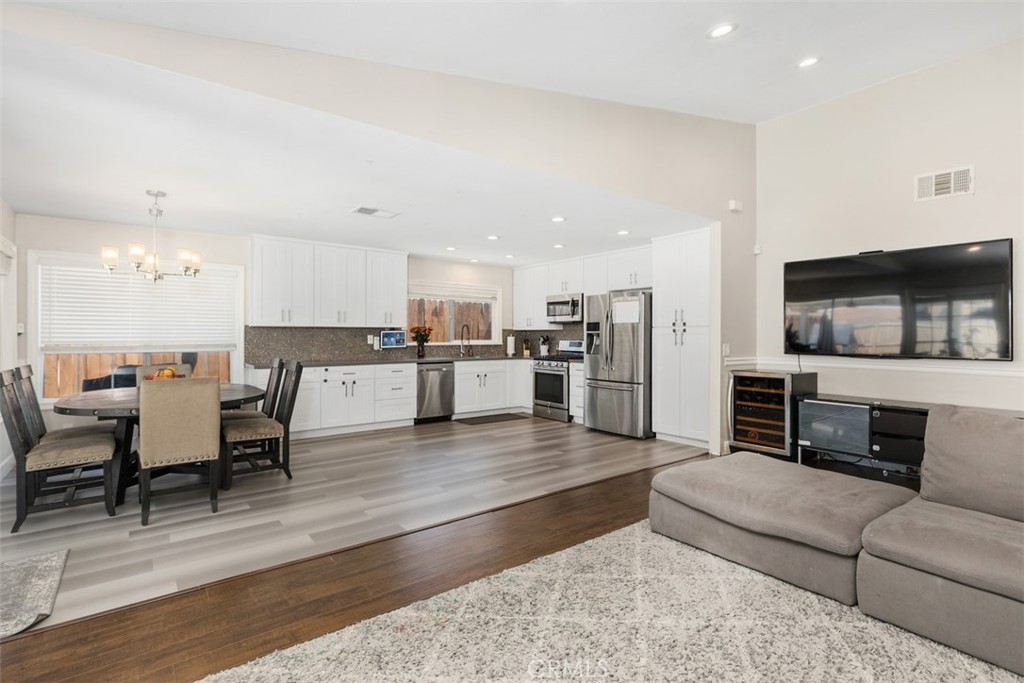 895 West Crestview Street Corona, CA 92882 - Photo 8 of 25 a living room with furniture and kitchen view