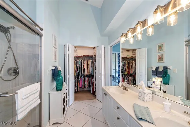 a view of walk in closet with clothes