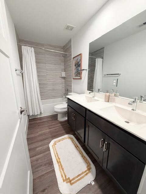 13725 Rising Sun Lane Conroe, TX 77384 - Photo 24 of 29 a bathroom with a double vanity sink toilet and shower