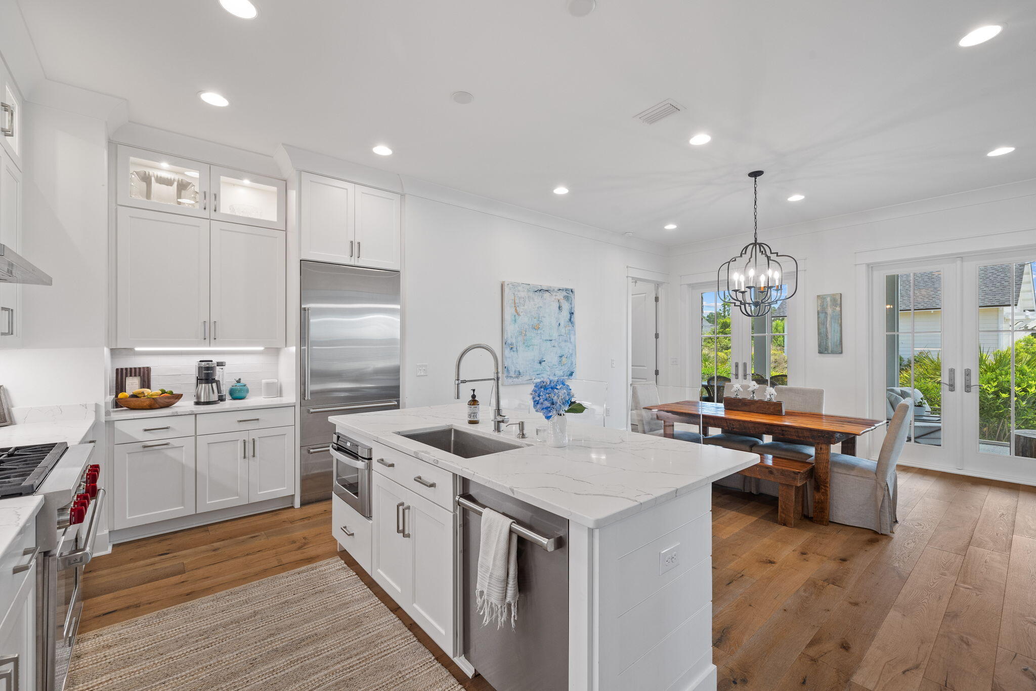 158 Trailhead Drive Inlet Beach, FL 32461 - Photo 7 of 35 a open kitchen with stainless steel appliances granite countertop a lot of counter space and wooden floors