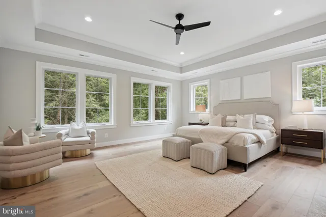 a large kitchen with kitchen island a island a sink a stove a dining table and chairs