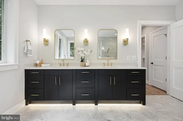 a kitchen with a sink a stove and cabinets