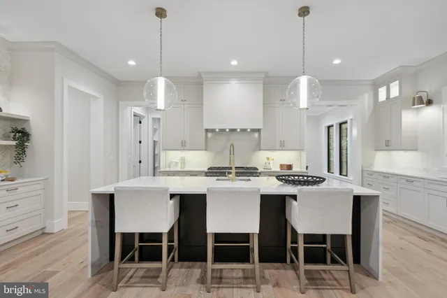 a view of livingroom with furniture staircase and windows