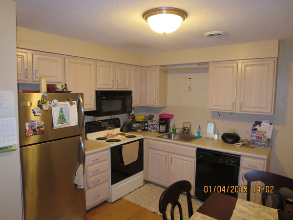 92 Beacon Street, Unit 5 Lawrence, MA 01843 - Photo 1 of 15 a kitchen with stainless steel appliances a stove refrigerator sink and cabinets