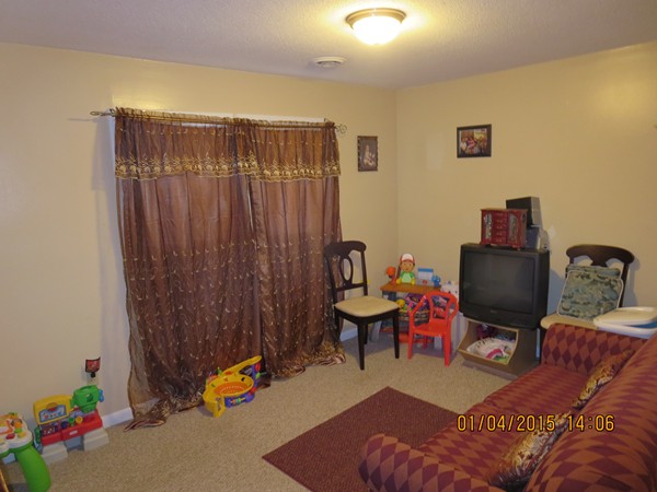 92 Beacon Street, Unit 5 Lawrence, MA 01843 - Photo 12 of 15 a reading room with furniture and wooden floor