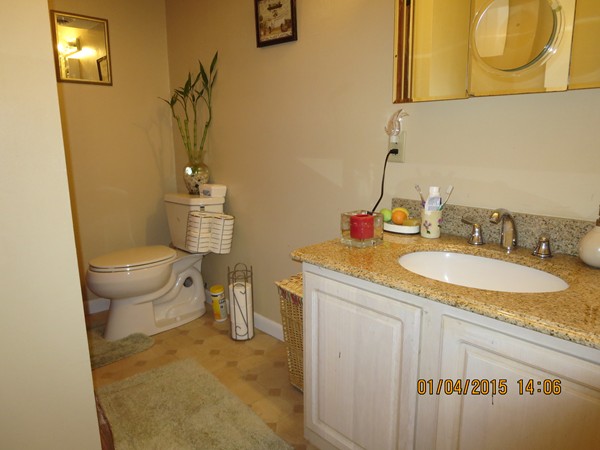 92 Beacon Street, Unit 5 Lawrence, MA 01843 - Photo 13 of 15 a bathroom with a granite countertop sink and a mirror