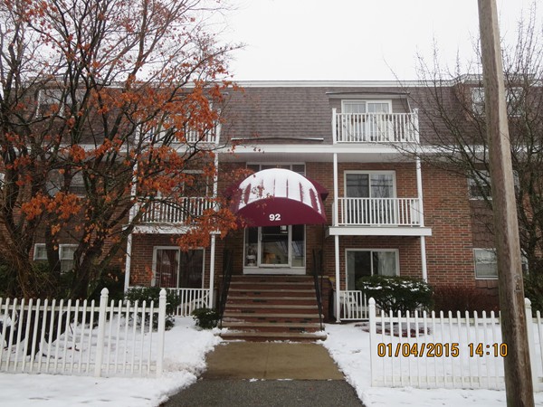 92 Beacon Street, Unit 5 Lawrence, MA 01843 - Photo 14 of 15 a front view of a house with a yard