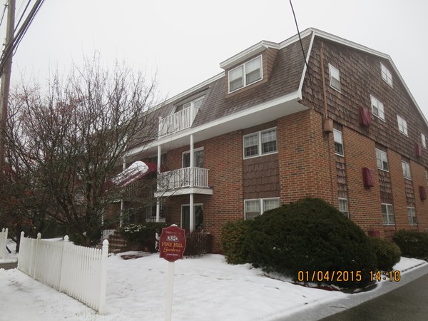 92 Beacon Street, Unit 5 Lawrence, MA 01843 - Photo 15 of 15 a front view of a house with a yard