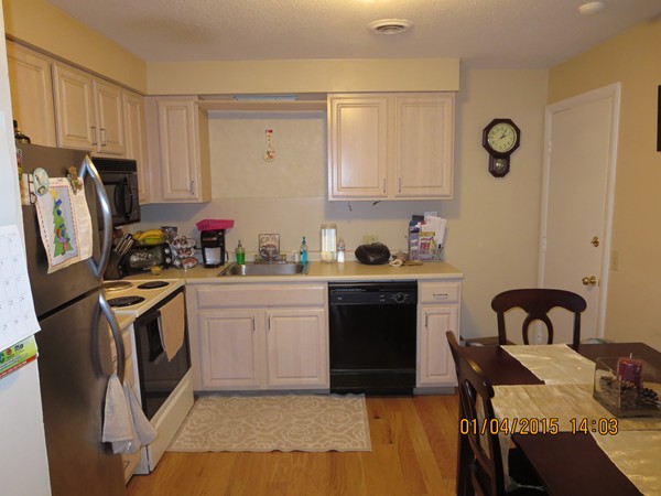92 Beacon Street, Unit 5 Lawrence, MA 01843 - Photo 3 of 15 a kitchen with stainless steel appliances granite countertop a stove top oven a sink dishwasher and a refrigerator