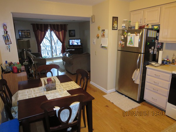 92 Beacon Street, Unit 5 Lawrence, MA 01843 - Photo 4 of 15 a view of a dining room with furniture window and wooden floor