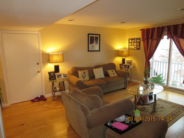 92 Beacon Street, Unit 5 Lawrence, MA 01843 - Photo 8 of 15 a living room with furniture and a large window