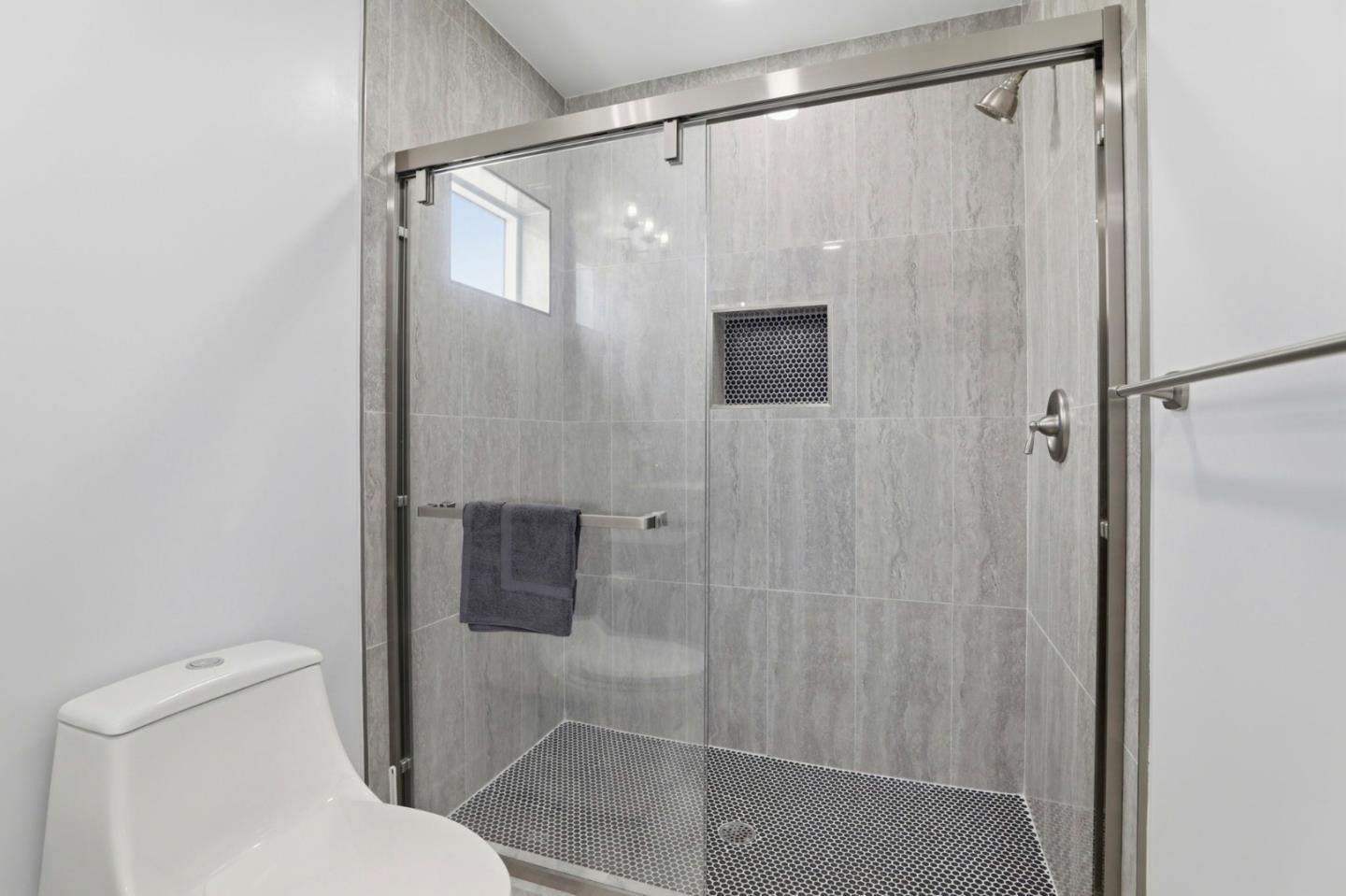 1802 Ponca Court Fremont, CA 94539 - Photo 20 of 28 a bathroom that has a glass shower door