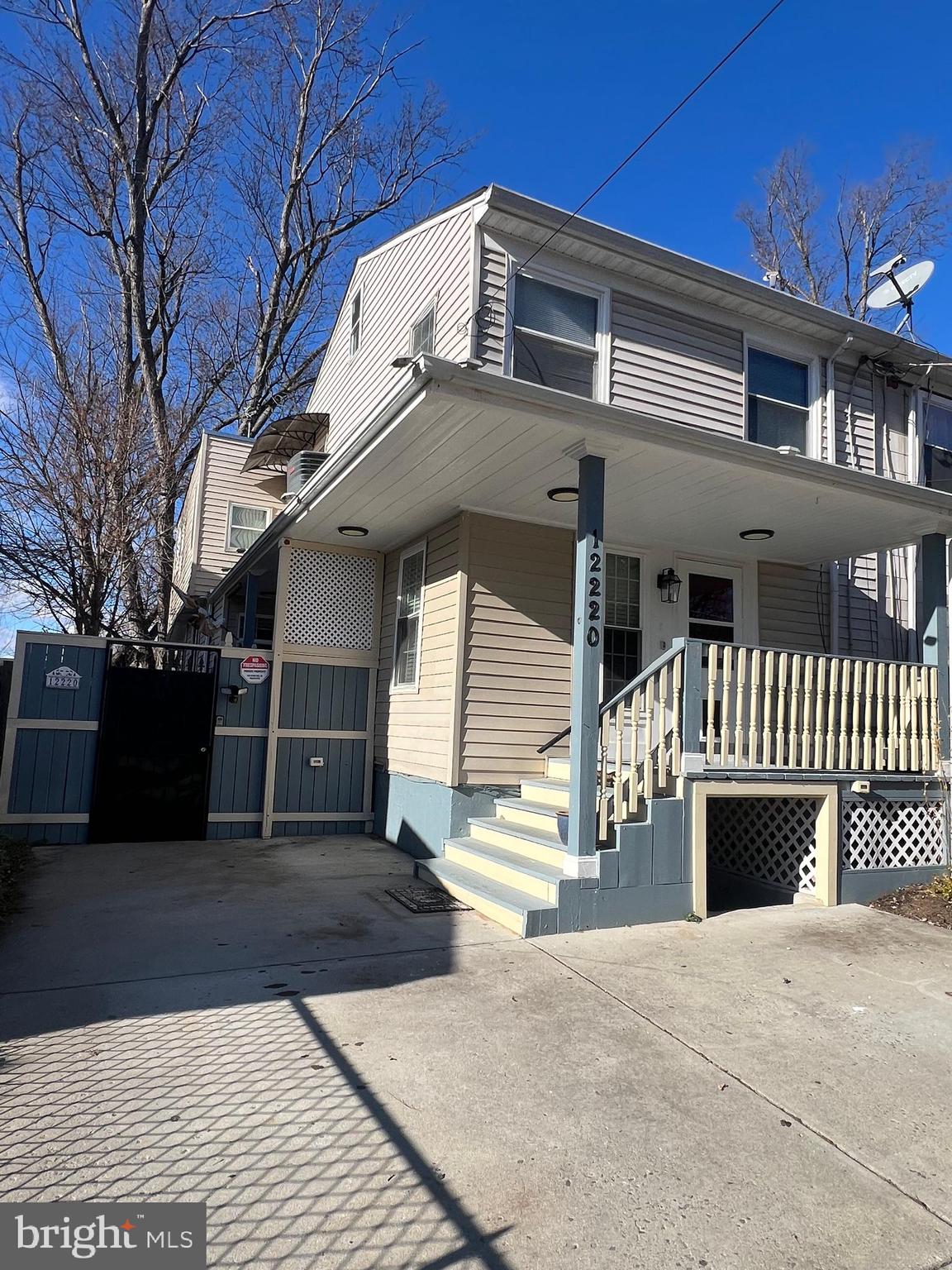 12220 Centerhill Street Silver Spring, MD 20902 - Photo 2 of 73 Exterior of house showing A/C and gate