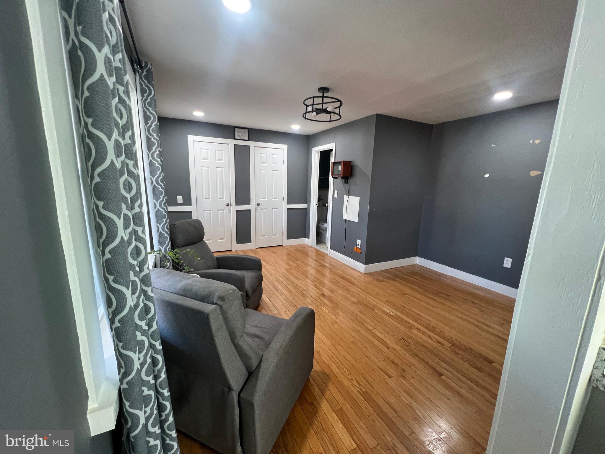 12220 Centerhill Street Silver Spring, MD 20902 - Photo 54 of 73 View of living area & double closets in upper stud