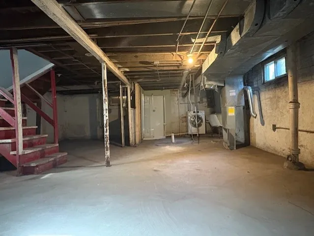 a view of an empty room with wooden roof