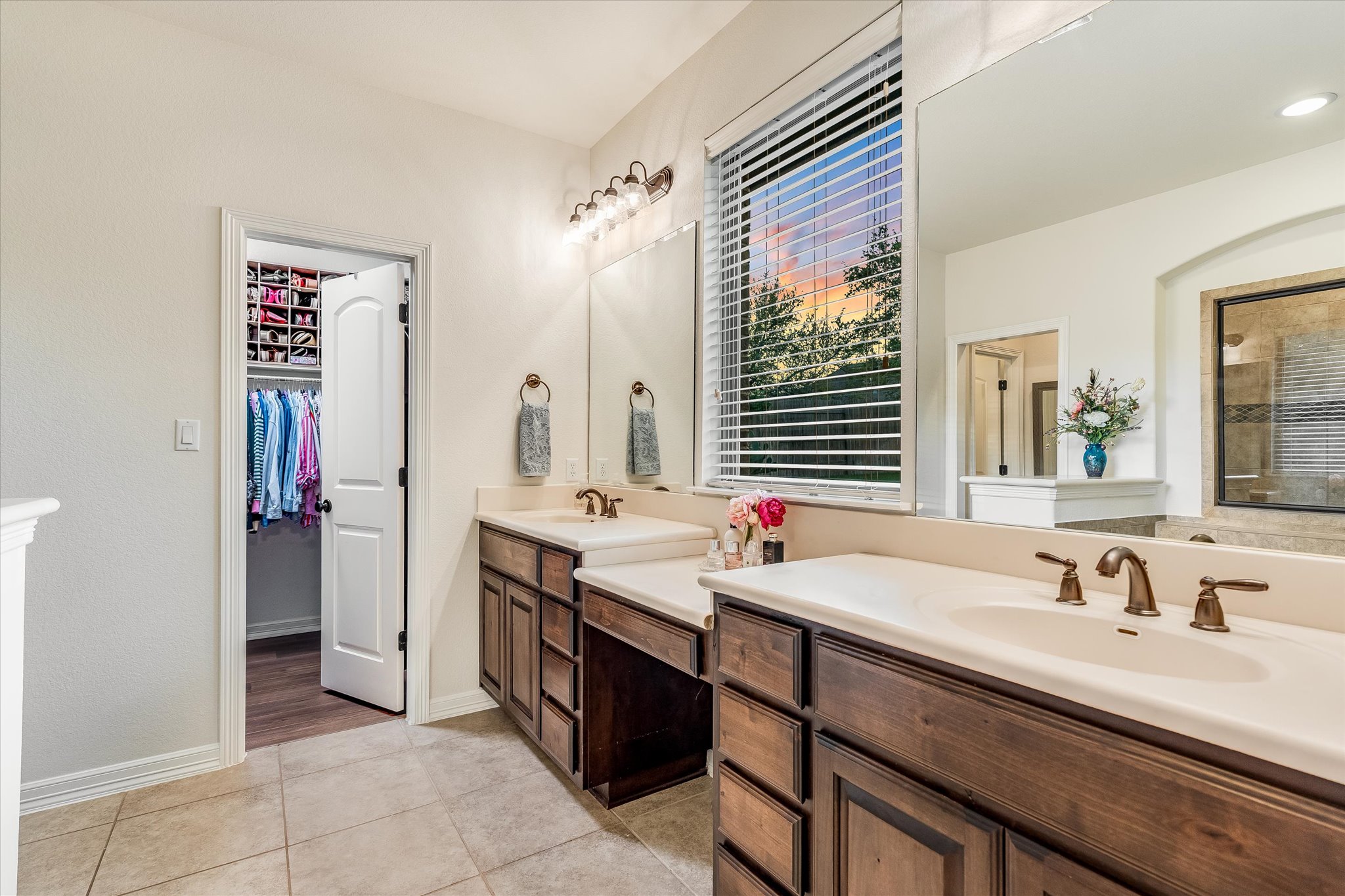 226 Galloway Lane Austin, TX 78737 - Photo 18 of 30 Full bathroom with two vanities, a spacious closet, and light tile patterned flooring