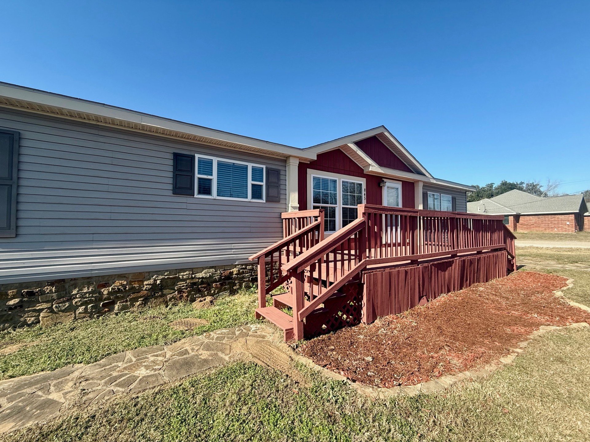 845 Caldwell Street Lexington, TX 78947 - Photo 1 of 39 Rear view of property with a deck, stairway, and a lawn