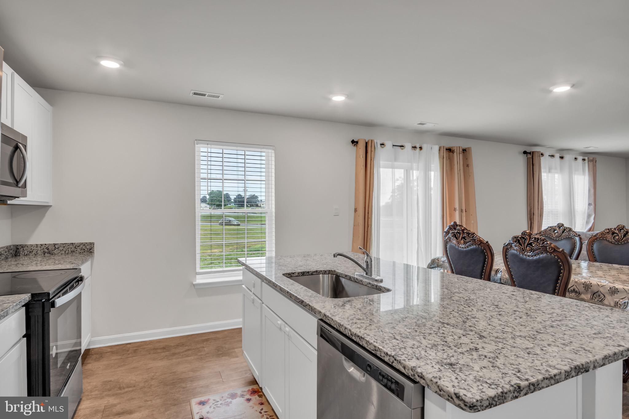 18 Smokehouse Road Carlisle, PA 17013 - Photo 12 of 33 a kitchen with granite countertop a sink and a counter top space
