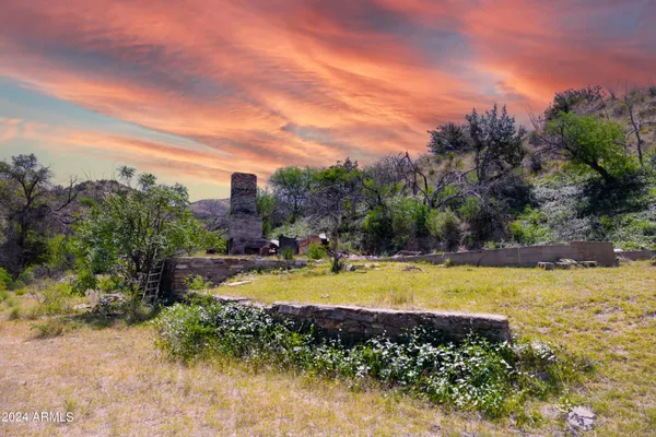 a view of a swimming pool with an outdoor space and seating area