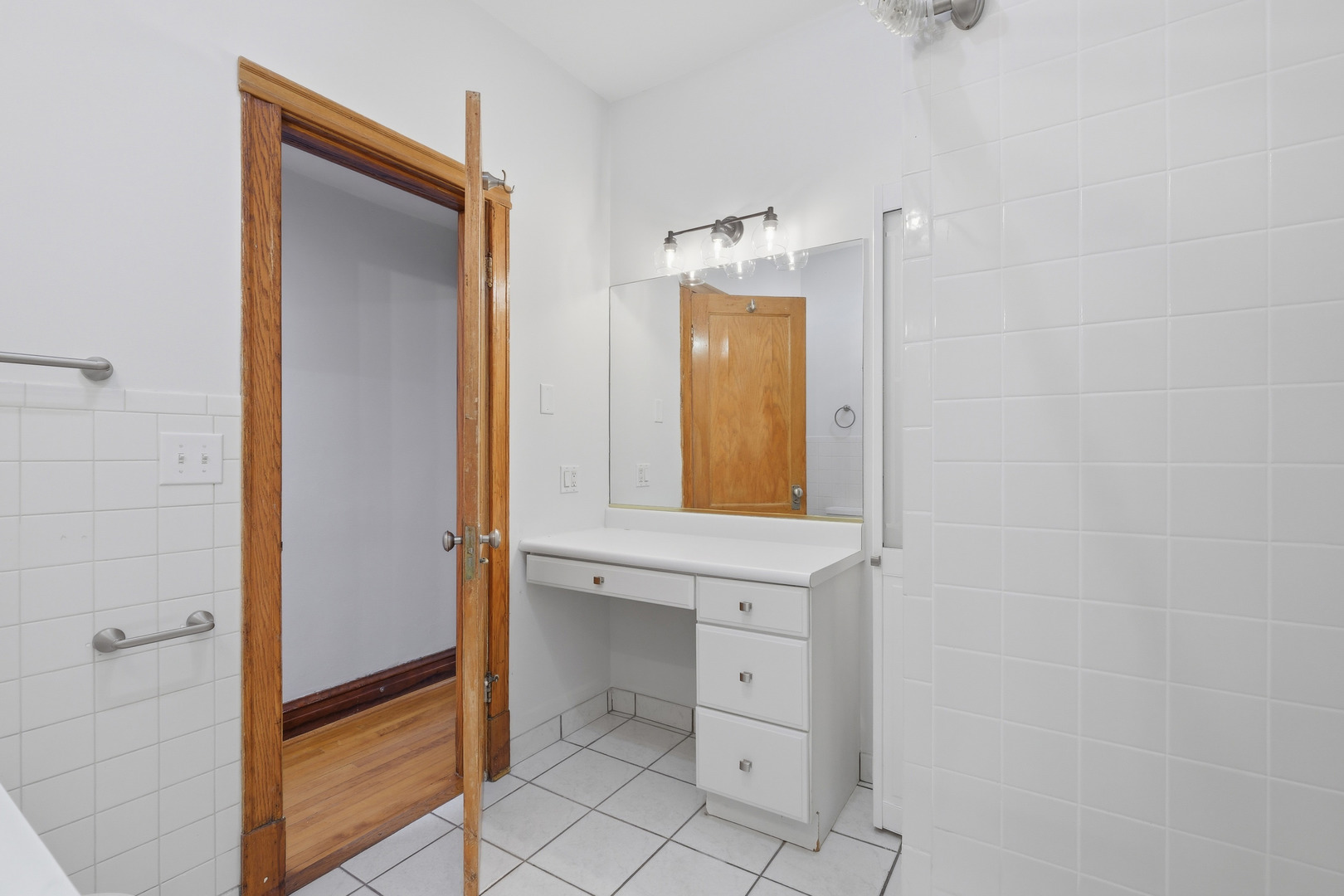 823 North Hoyne Avenue, Unit 2 Chicago, IL 60622 - Photo 12 of 20 a bathroom with a sink and a mirror