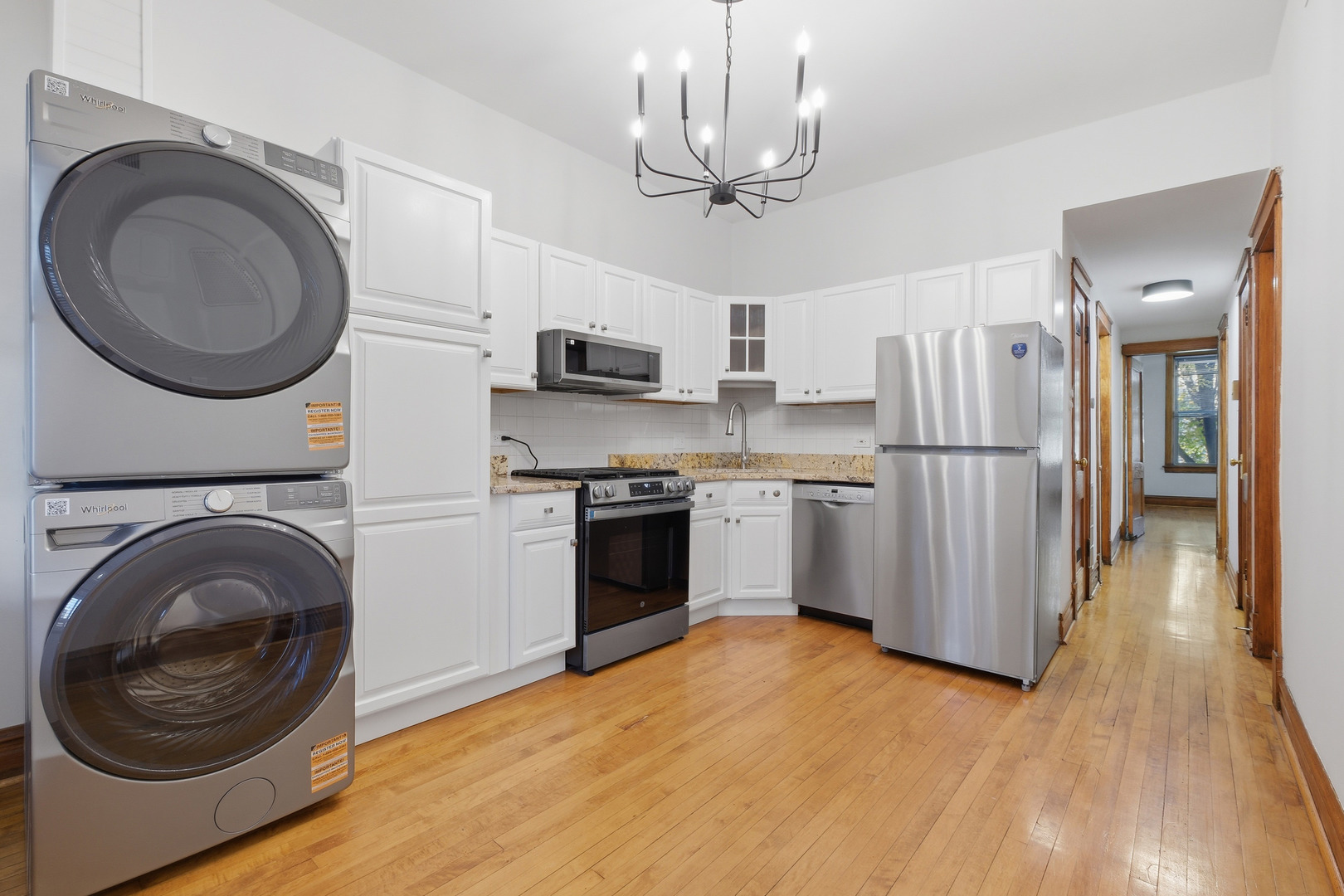 823 North Hoyne Avenue, Unit 2 Chicago, IL 60622 - Photo 2 of 20 a kitchen with stainless steel appliances a stove a refrigerator and a sink