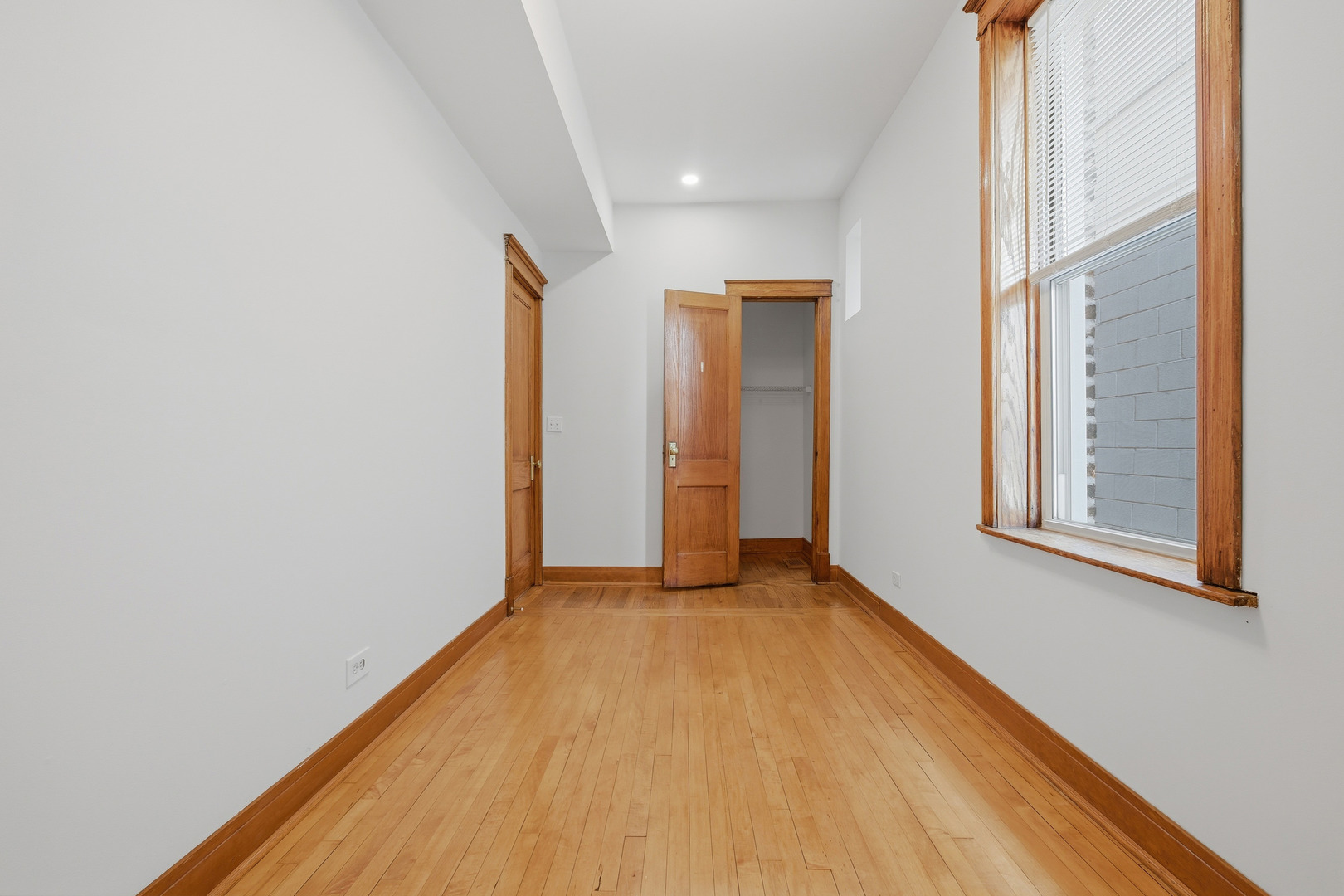 823 North Hoyne Avenue, Unit 2 Chicago, IL 60622 - Photo 10 of 20 a view of a room with wooden floor and a window