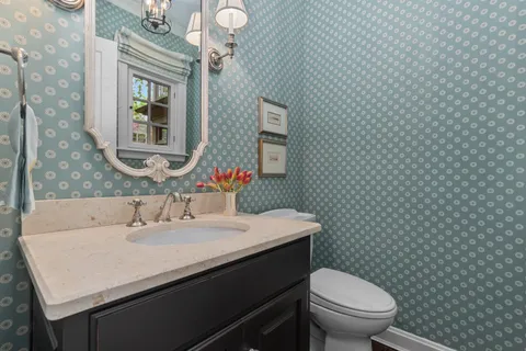 a bedroom with furniture and a wooden floor