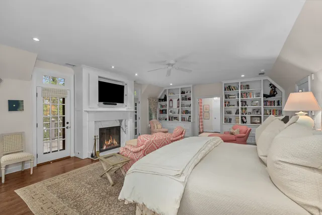 a living room with furniture and a book shelf