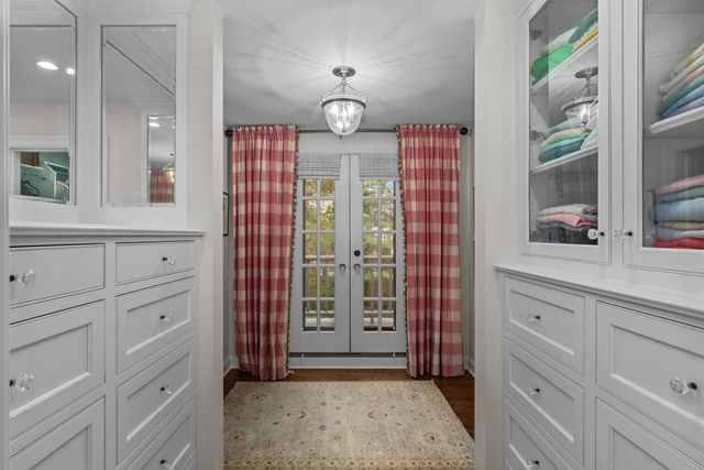 a bathroom with a sink double vanity granite and a mirror