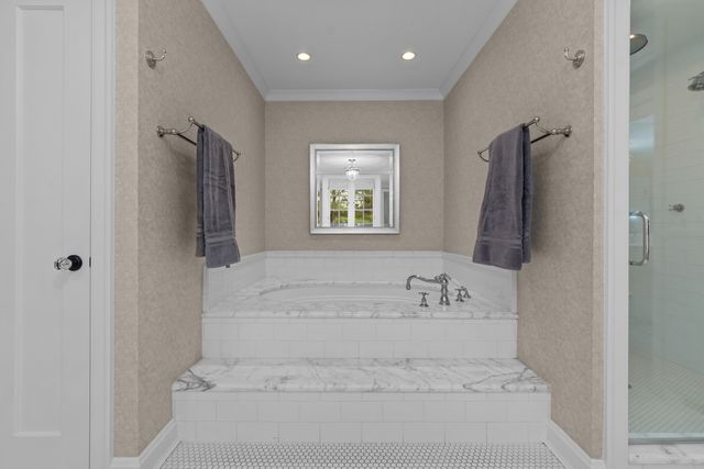 a living room with furniture and floor to ceiling window