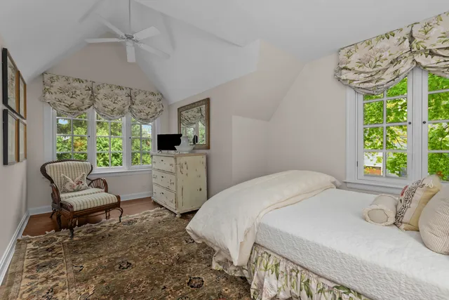 a bedroom with a bed and a table in it