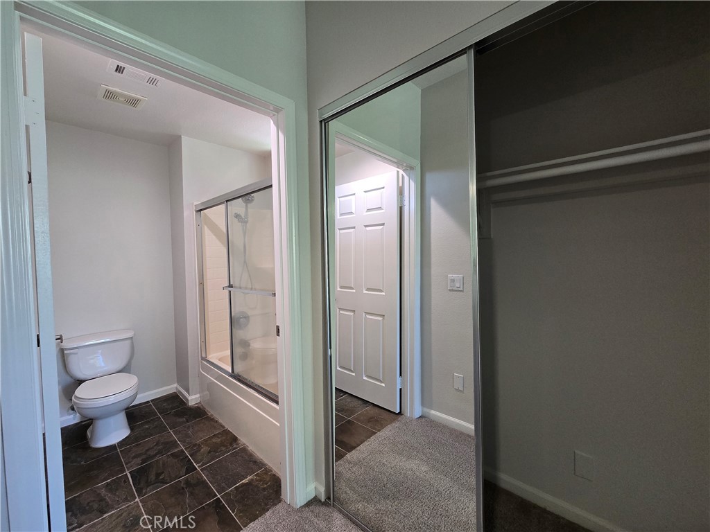 375 Central Avenue, Unit 14 Riverside, CA 92507 - Photo 16 of 22 a bathroom with a toilet and a shower