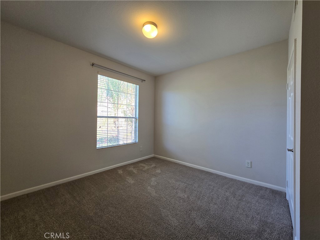 375 Central Avenue, Unit 14 Riverside, CA 92507 - Photo 20 of 22 an empty room with a window