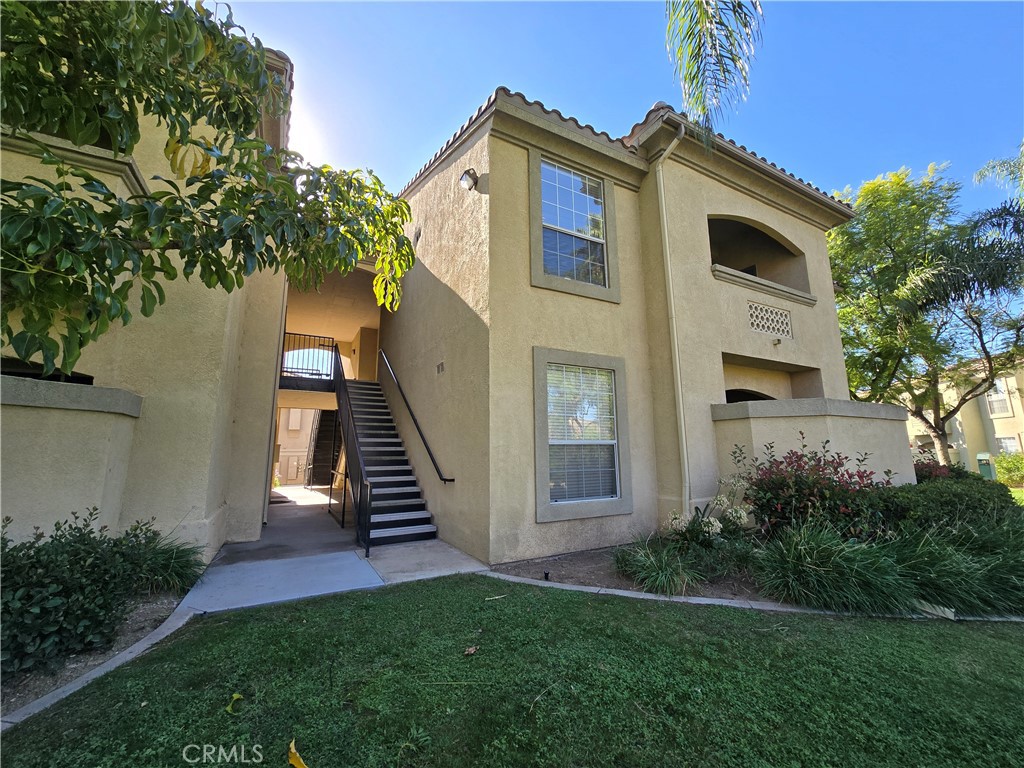 375 Central Avenue, Unit 14 Riverside, CA 92507 - Photo 2 of 22 a front view of a house with a yard