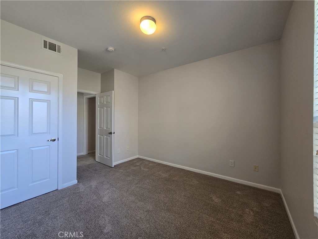 375 Central Avenue, Unit 14 Riverside, CA 92507 - Photo 21 of 22 an empty room with closet area