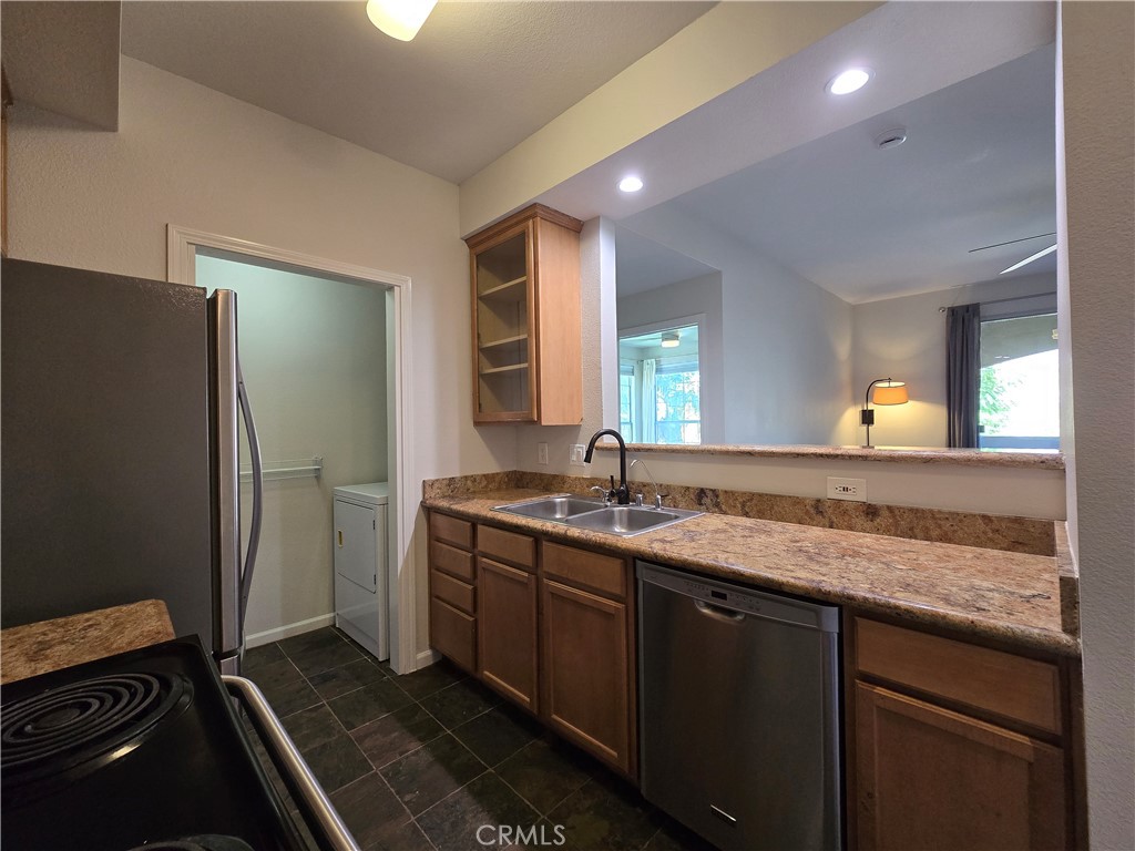 375 Central Avenue, Unit 14 Riverside, CA 92507 - Photo 9 of 22 a bathroom with a granite countertop sink and a mirror