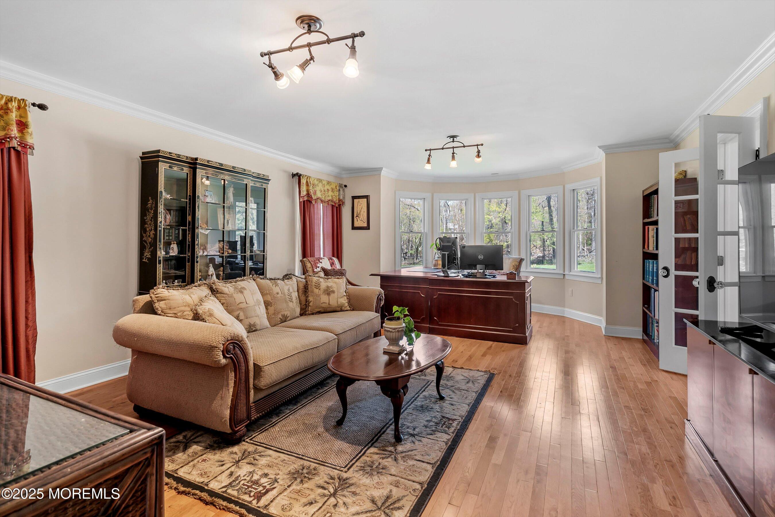 39 Primrose Lane Colts Neck, NJ 07722 - Photo 17 of 52 a living room with furniture and a wooden floor