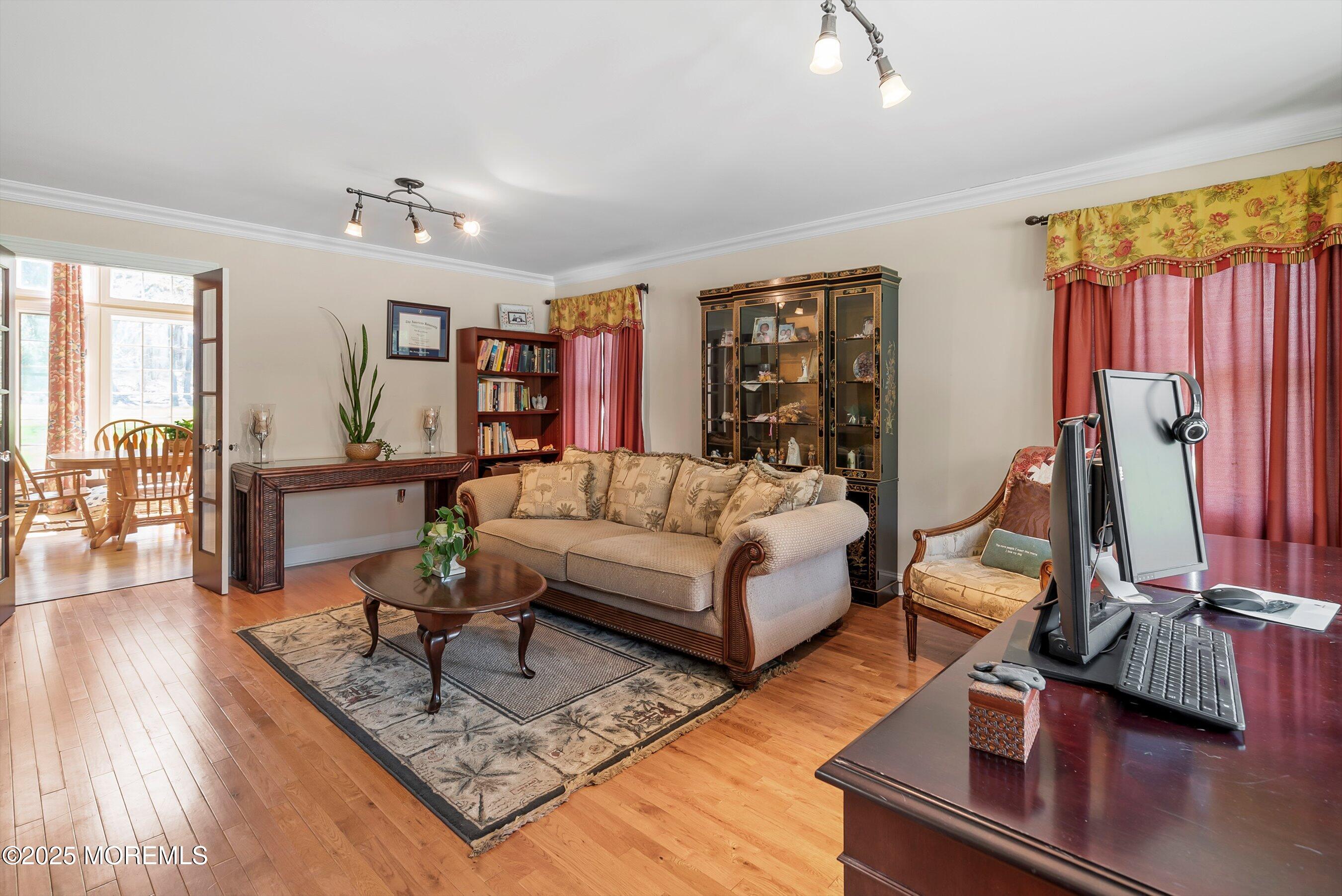 39 Primrose Lane Colts Neck, NJ 07722 - Photo 18 of 52 a living room with furniture and a flat screen tv