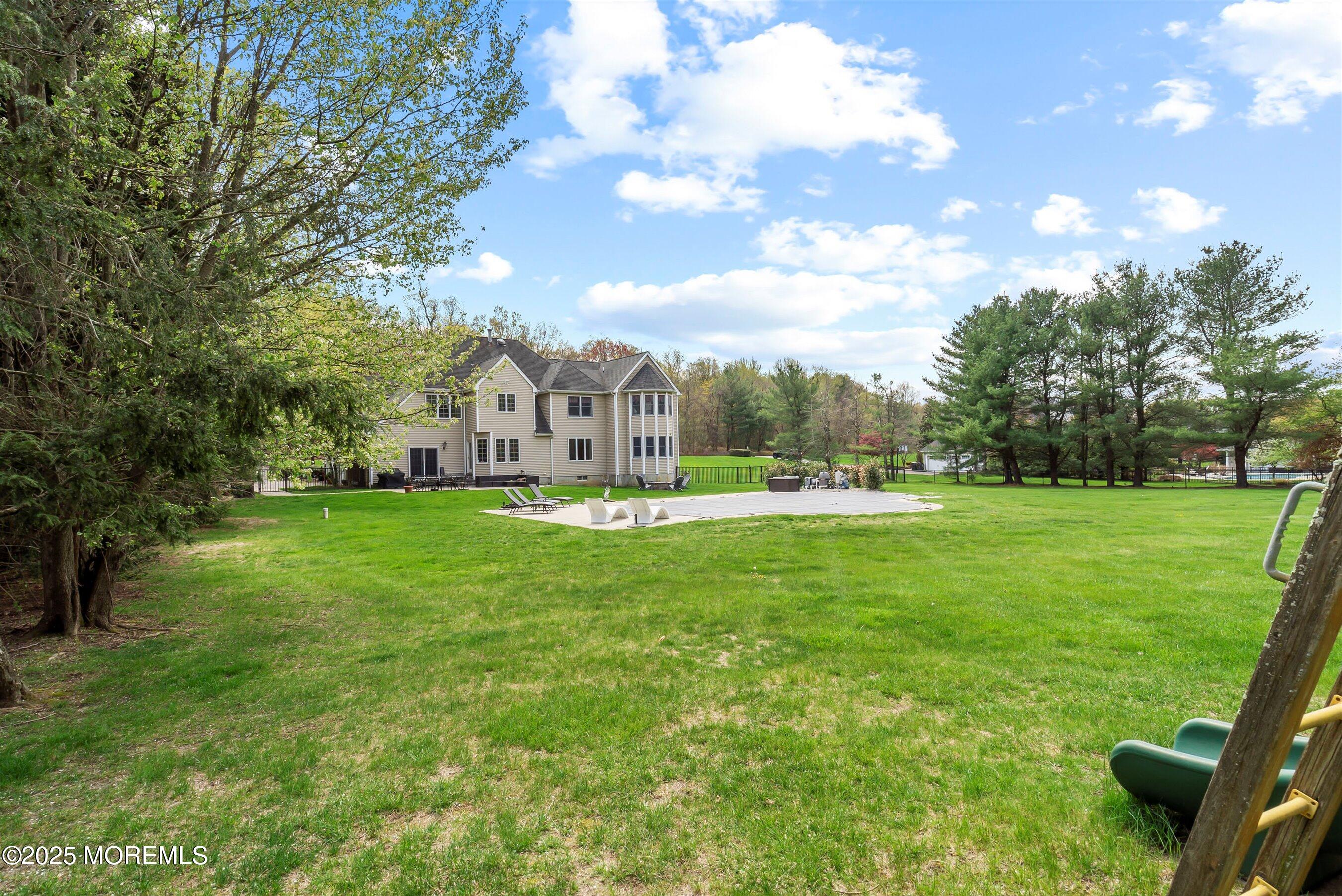 39 Primrose Lane Colts Neck, NJ 07722 - Photo 22 of 52 a view of house with garden space and street view