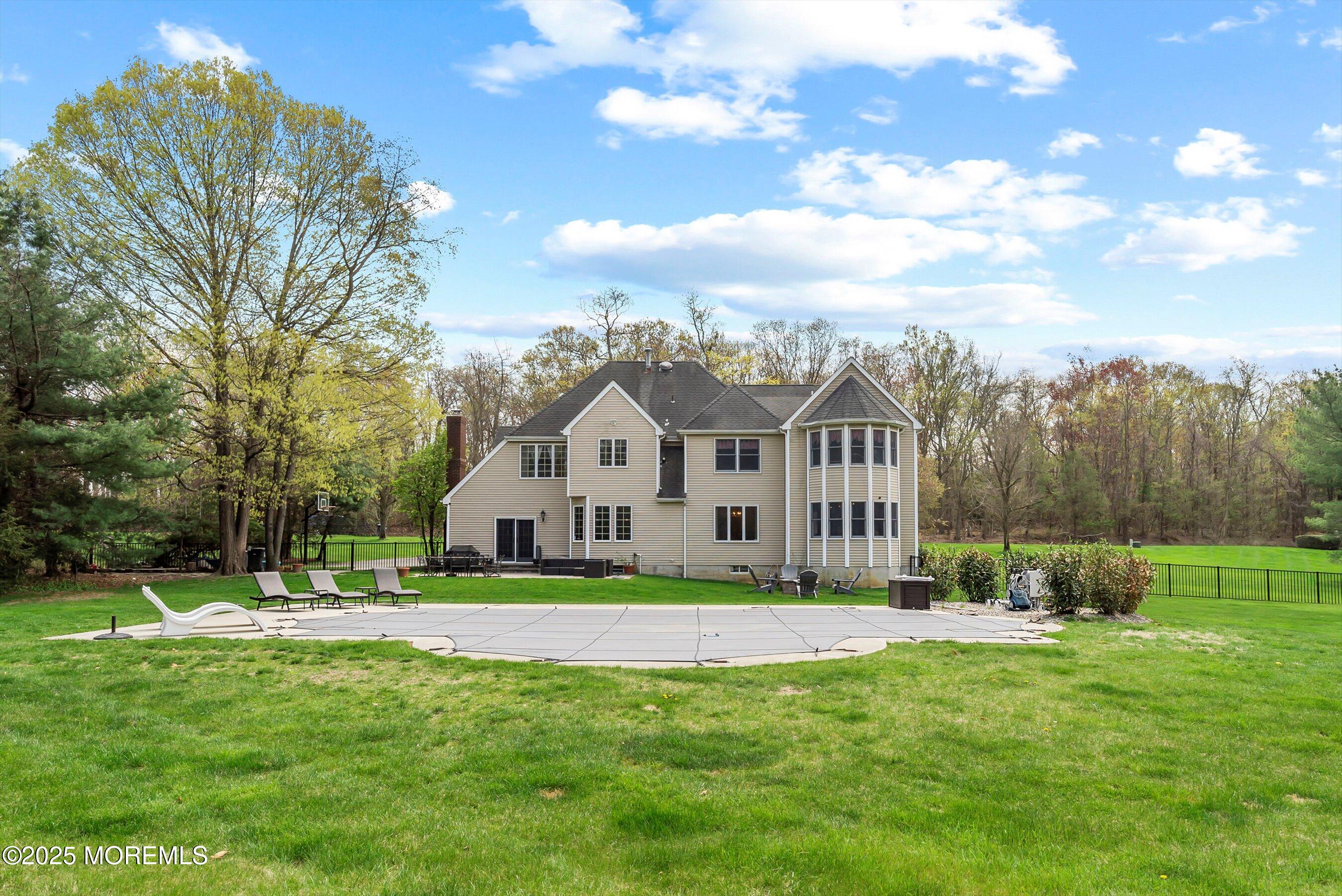 39 Primrose Lane Colts Neck, NJ 07722 - Photo 3 of 52 a front view of a house with a yard